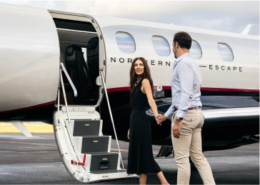 couple walking onto plane